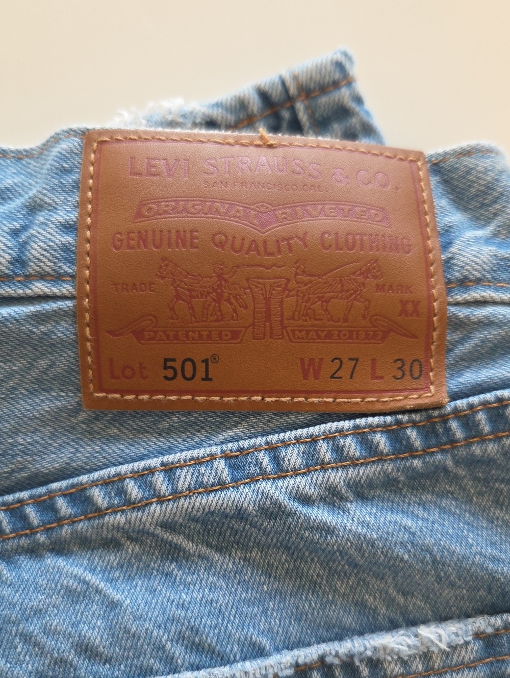Levi's Women's Straight Jeans in Light Blue with Tan Leather Patch.